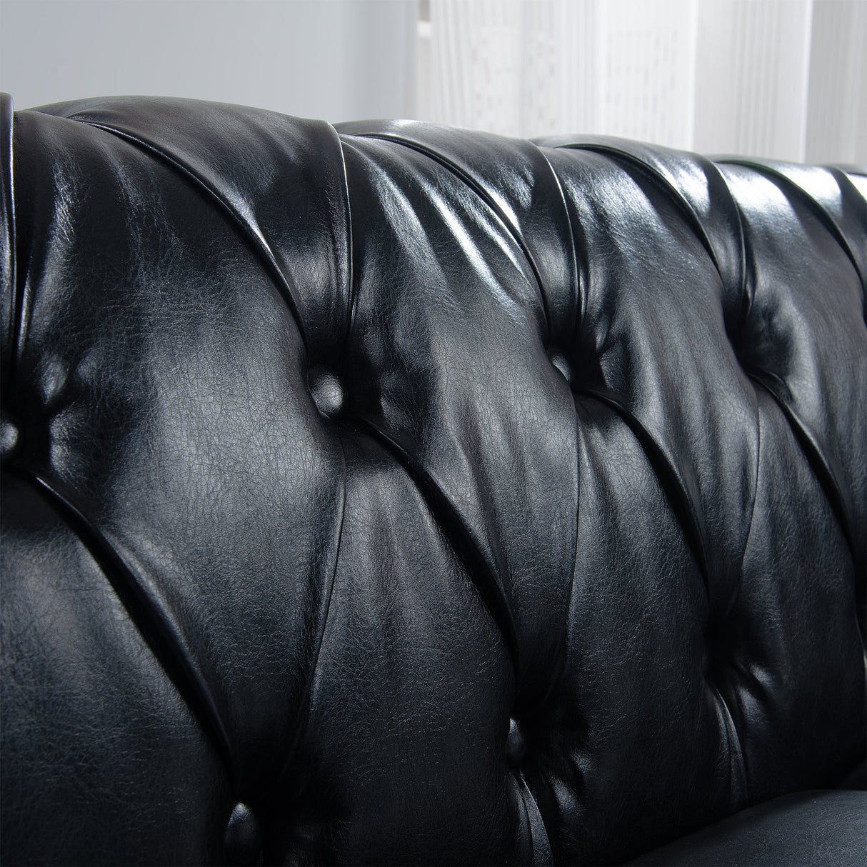 84.65' Black PU Rolled Arm Chesterfield Three Seater Sofa