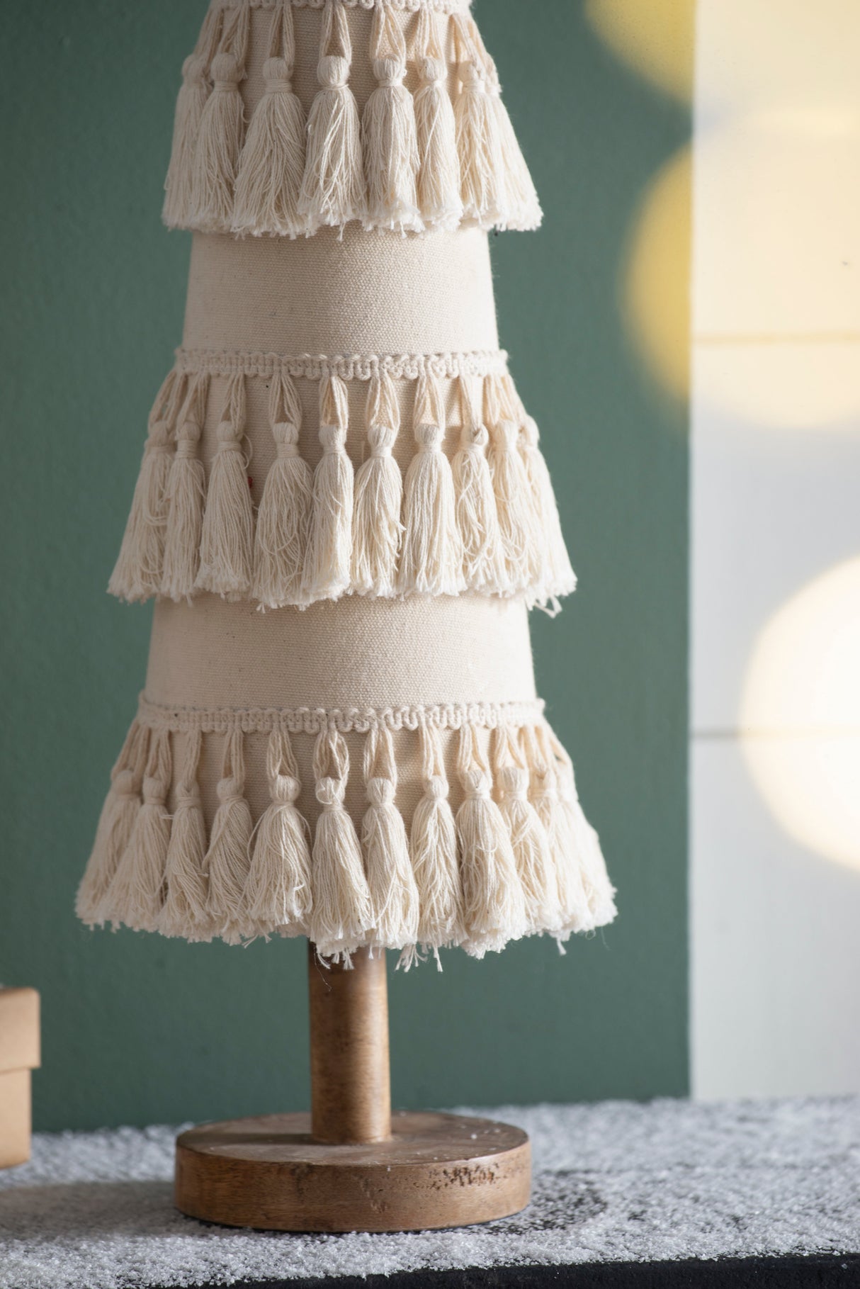 Fringes Embellished Cone With Wooden Base