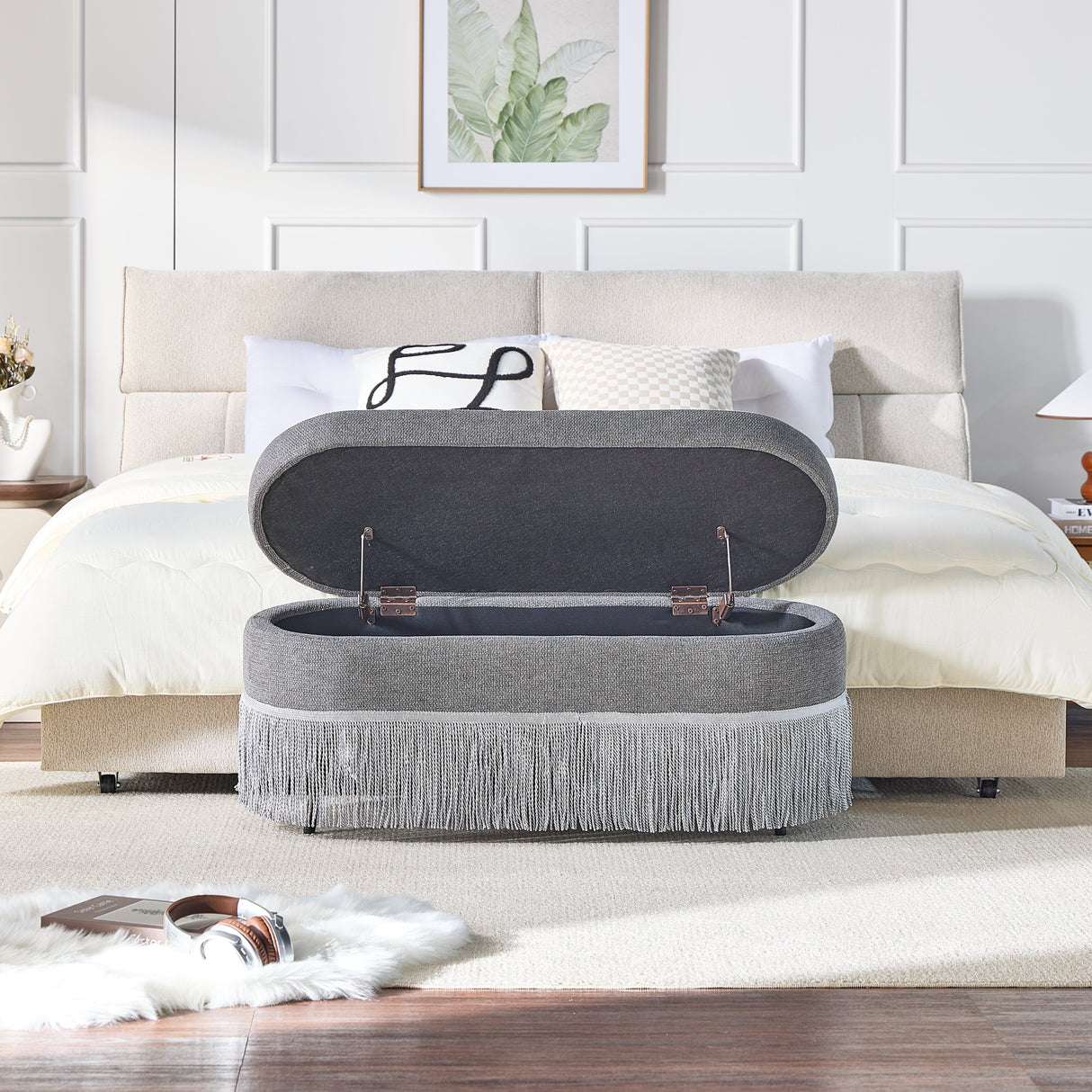 Oval Upholstered Storage Ottoman with Fringe Trim