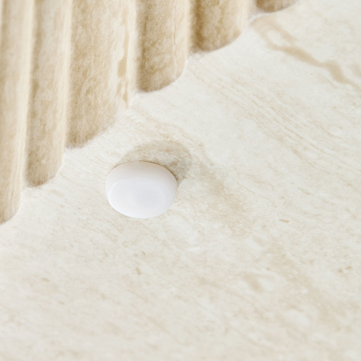 Faux Travertine Round Coffee Table with Eye-Catching Relief Design