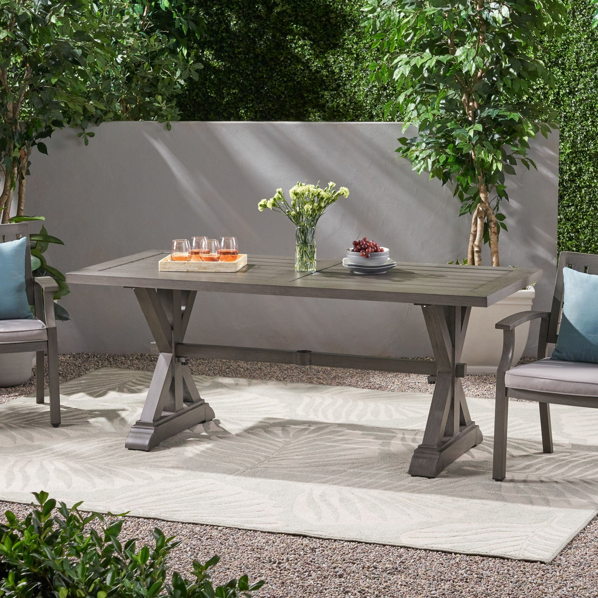 Modern Outdoor Dining Table With X-Shaped Legs and Umbrella Hole