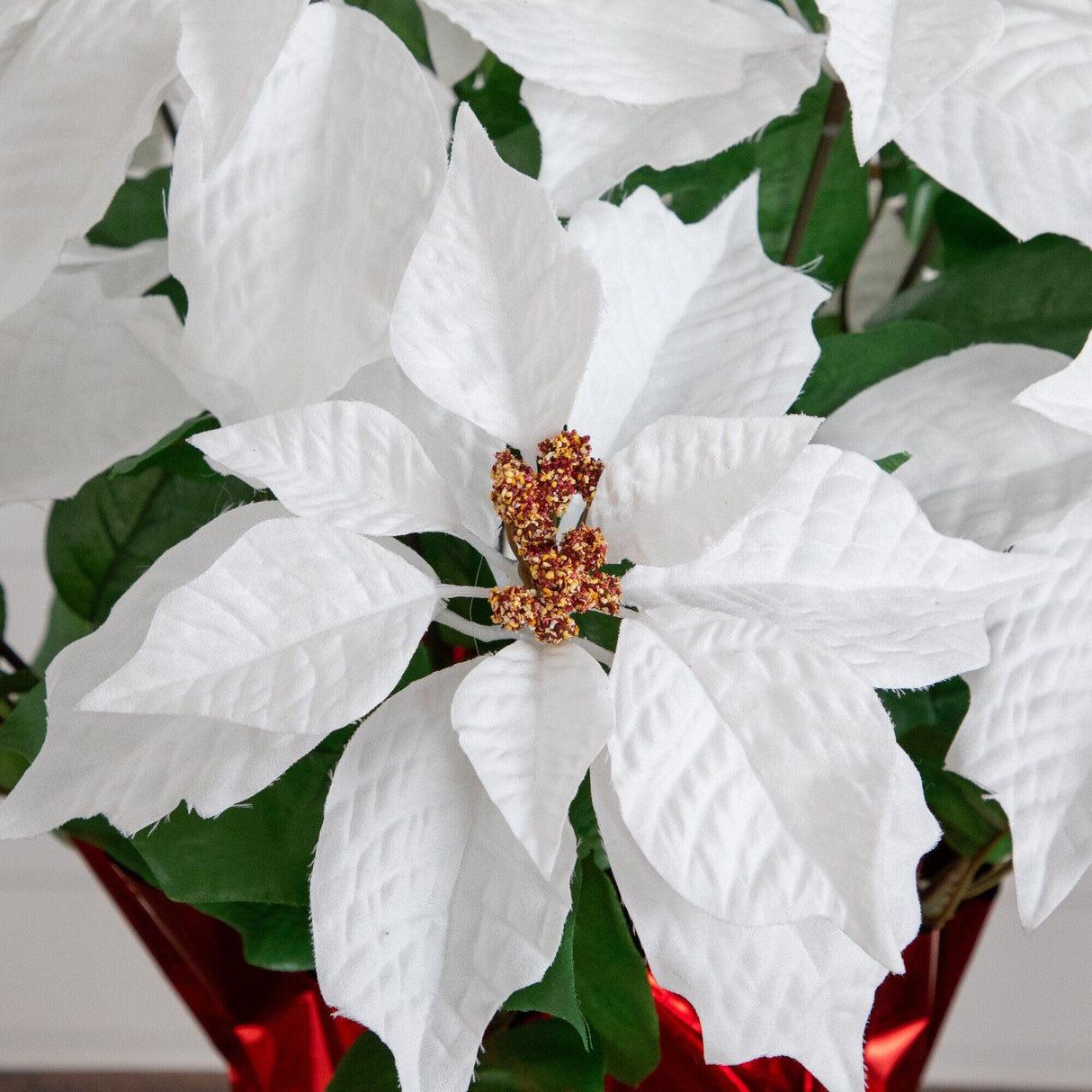 19” Artificial Lush White Poinsettia Arrangement in Red Wrapped Planter