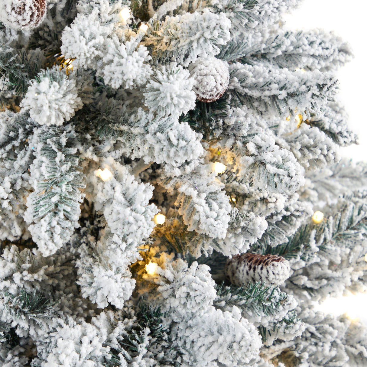4.5’ Flocked Livingston Fir Artificial Christmas Tree with Pine Cones and 150 Clear Warm LED Lights in Tall White Planter