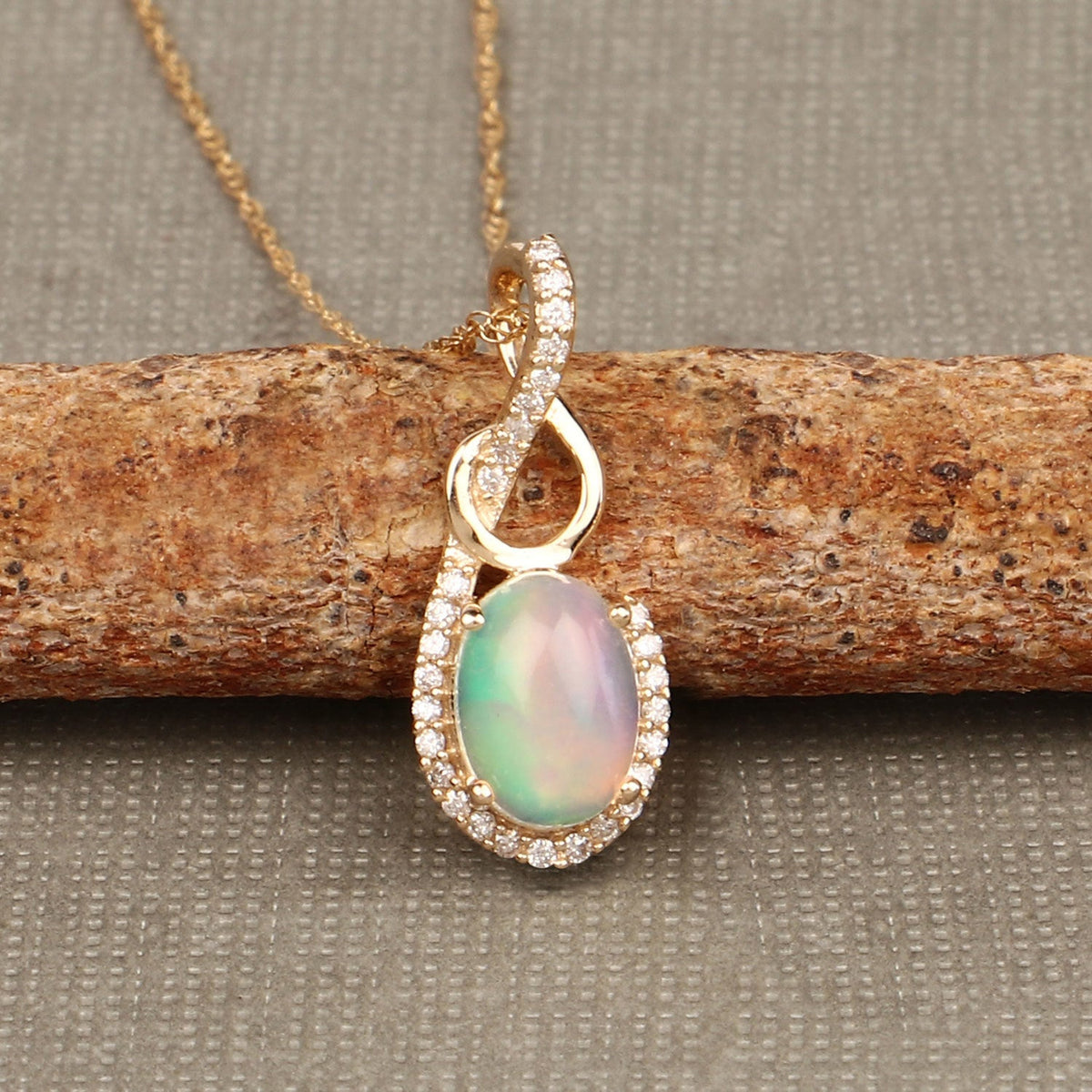 0.56 Carat Genuine Ethiopian Opal and White Diamond 14K Yellow Gold Pendant