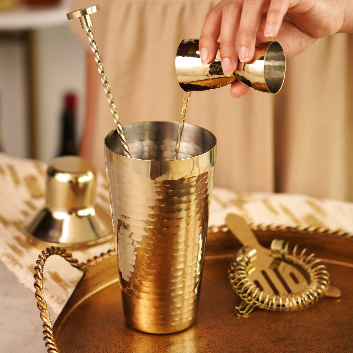 Gold hammered barware set by twine