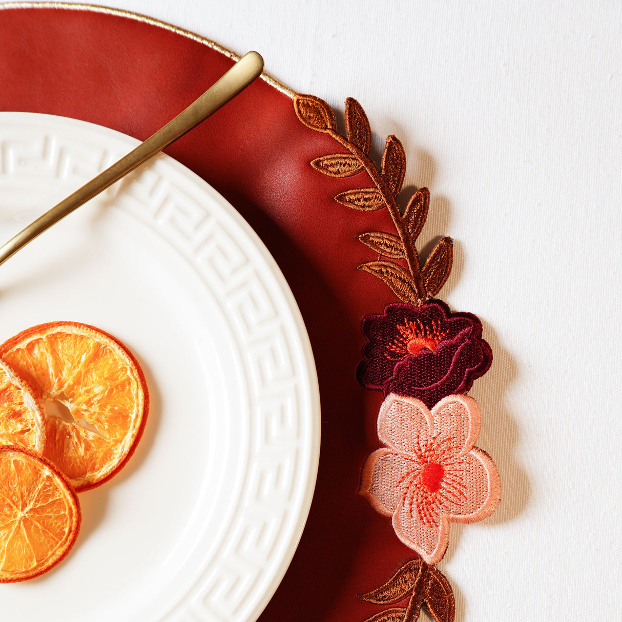 JASMINE DARK ORANGE ROUND FAUX LEATHER PLACEMAT