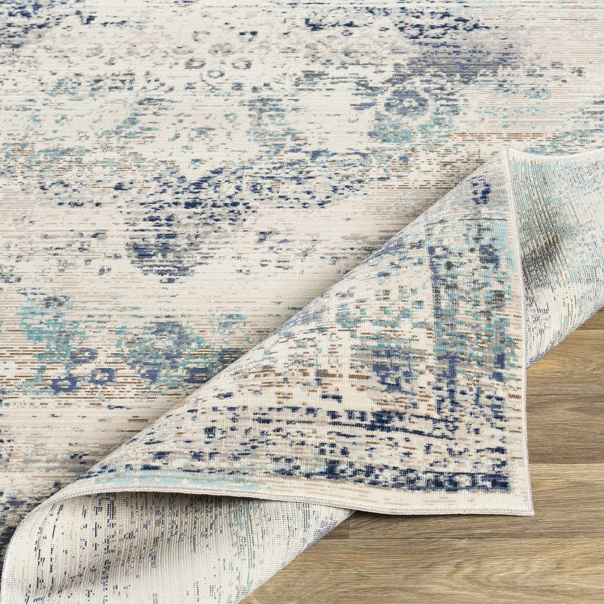 Needingworth Area Rug - Clearance