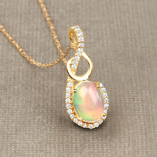0.56 Carat Genuine Ethiopian Opal and White Diamond 14K Yellow Gold Pendant
