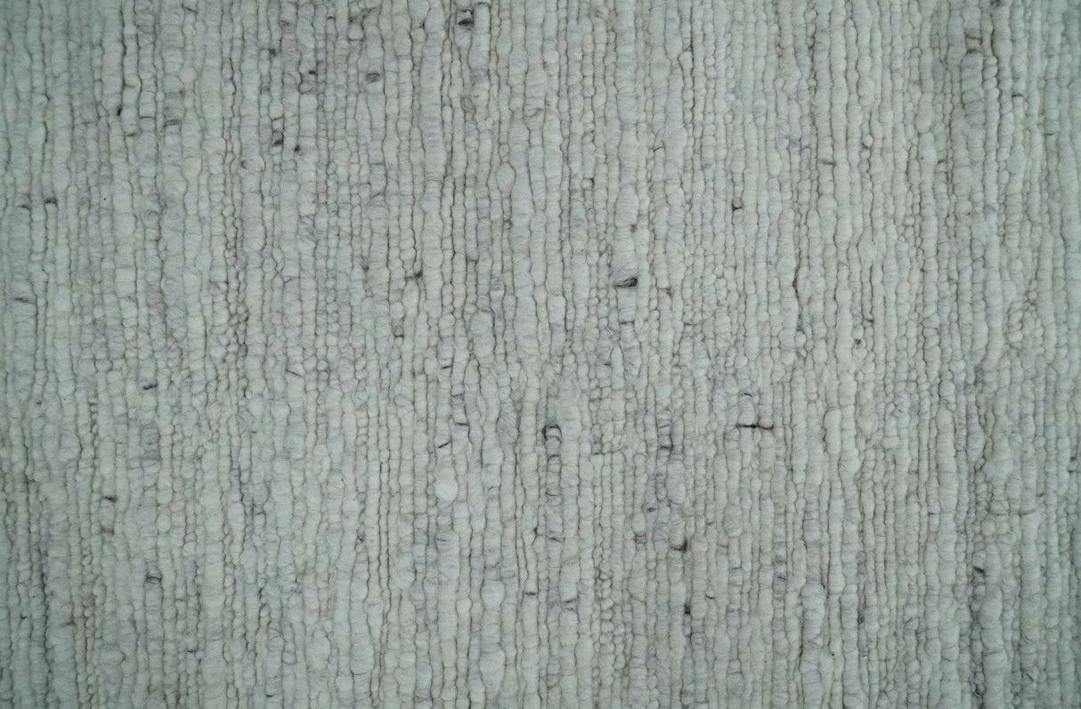 Premium Contemporary loop Pile Ivory Hand woven wool Area Rug