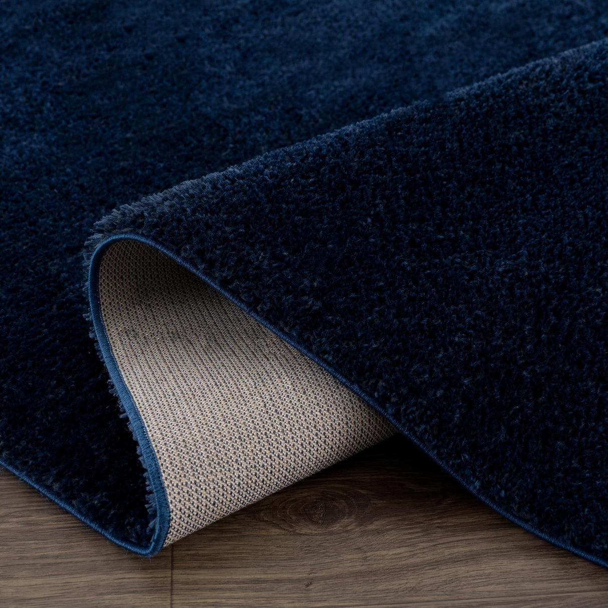 Navero Dark Blue Subtle Wavy Abstract Modern Minimalist Polyester Machine Woven Area Rug - Clearance