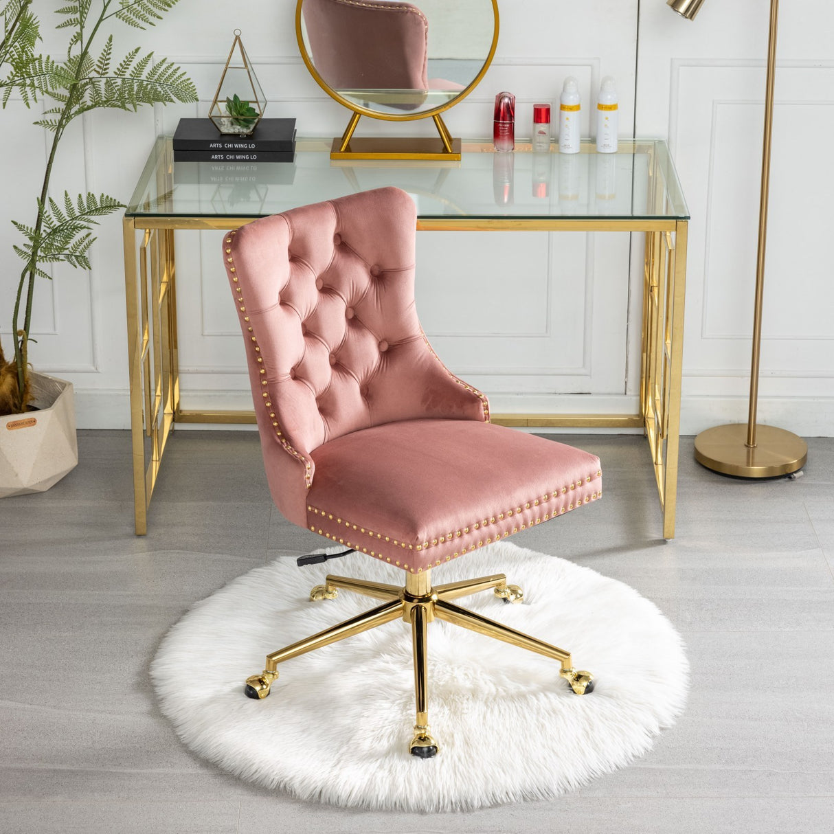 Velvet upholstered tufted chair with golden metal adjustable swivel base