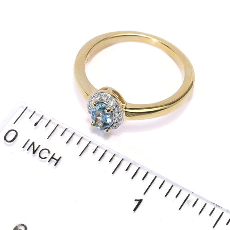 Gem Treasures 0.66ctw Oval Montana Sapphire & White Zircon Halo Ring