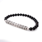 MUSE Platinum Plated Choice of Mantra Black Onyx Bead Stretch Bracelet