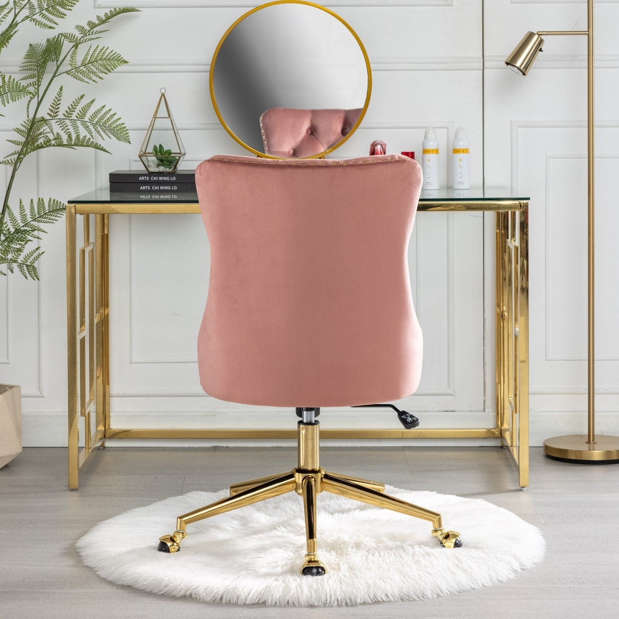 Velvet upholstered tufted chair with golden metal adjustable swivel base