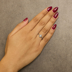 10K White Gold 5X3MM Oval Birthstone and Diamond Accent Halo Ring