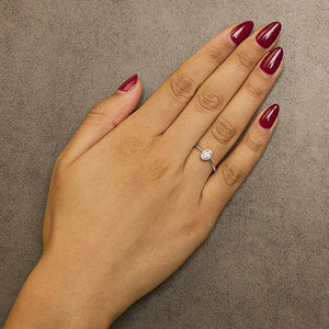 10K White Gold 5X3MM Oval Birthstone and Diamond Accent Halo Ring