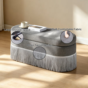 Oval Upholstered Storage Ottoman with Fringe Trim