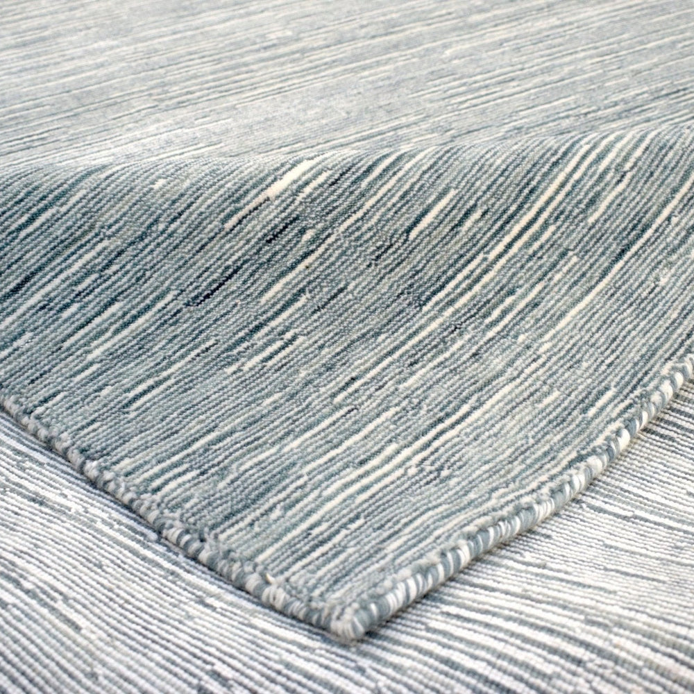 Solid Blue and Silver Wool And Viscose 5x8 Area Rug