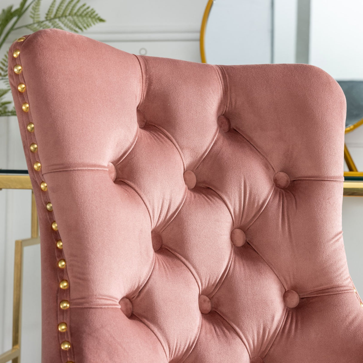 Velvet upholstered tufted chair with golden metal adjustable swivel base