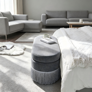 Oval Upholstered Storage Ottoman with Fringe Trim
