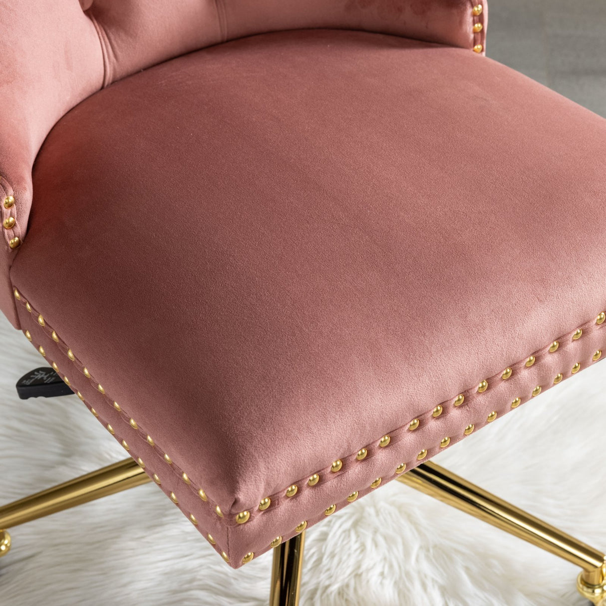 Velvet upholstered tufted chair with golden metal adjustable swivel base