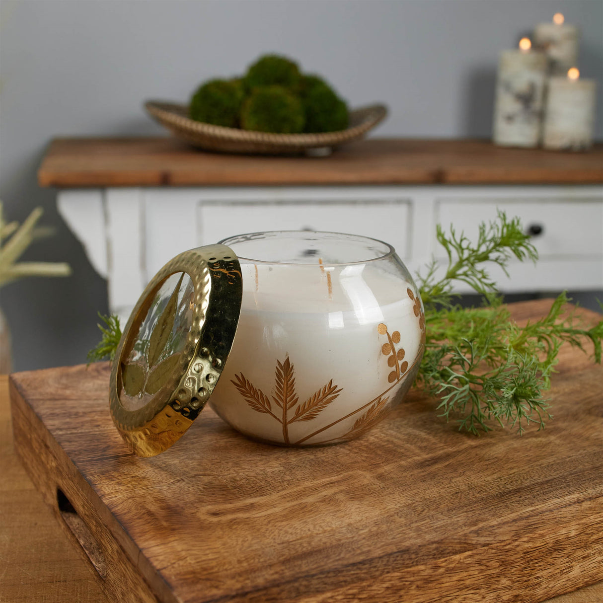 Frosted juniper scented soy candle with pressed leaf lid 5"d