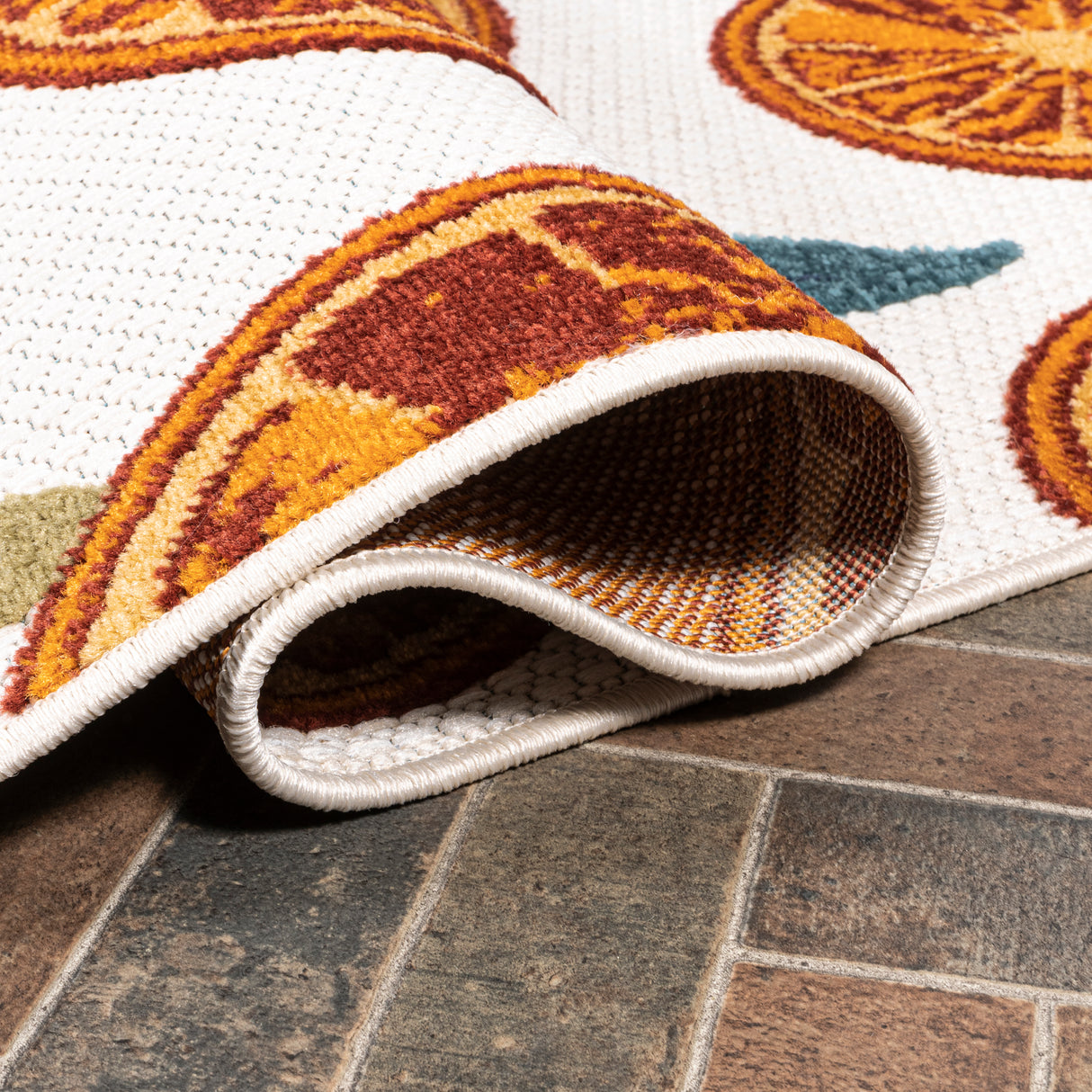 Aranciata citrus slice high-low indoor/outdoor area rug