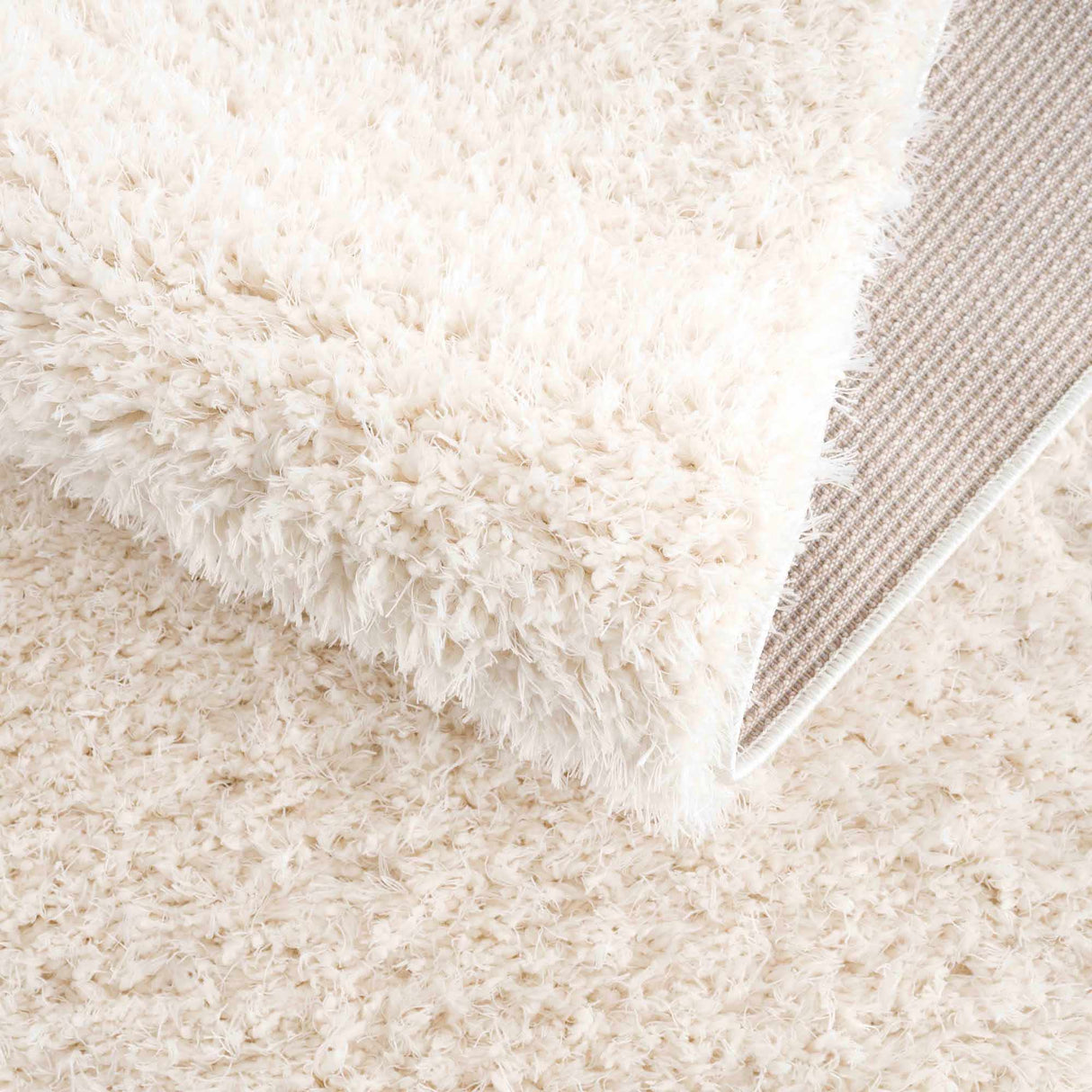 Faina Solid Cream Shag Washable Area Rug - Clearance