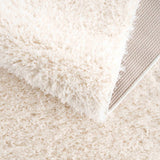 Faina Solid Cream Shag Washable Area Rug - Clearance