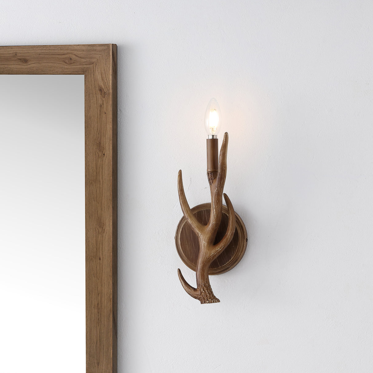 Cody 1-light southwestern bohemian resin/iron faux antler led sconce