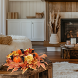 Harvest pumpkin and floral candle holder centerpiece