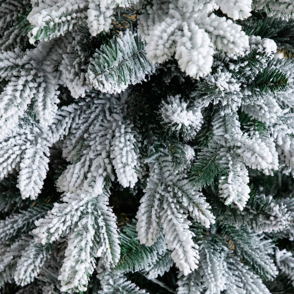 4' Pre-Lit Artificial Flocked Christmas Tree with 100 Warm White LED Lights in Decorative Trunk Planter