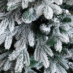 4' Pre-Lit Artificial Flocked Christmas Tree with 100 Warm White LED Lights in Decorative Trunk Planter