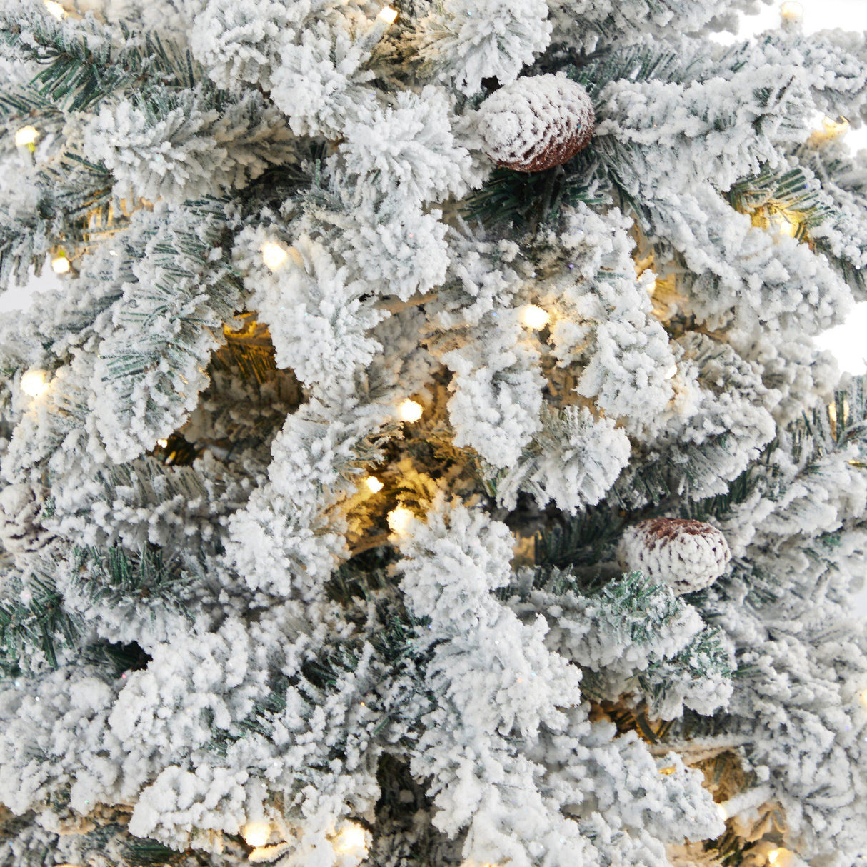 4.5’ Flocked Livingston Fir Artificial Christmas Tree with Pine Cones and 150 Clear Warm LED Lights in Charcoal Urn