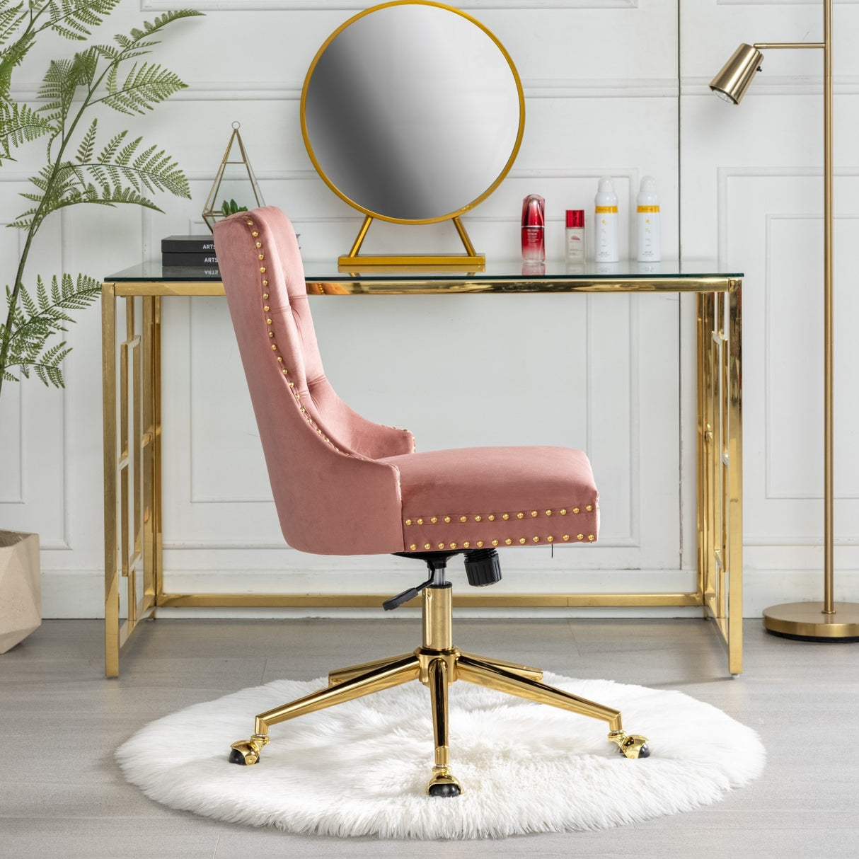 Velvet upholstered tufted chair with golden metal adjustable swivel base