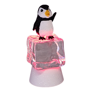 Penguin Sitting on Color-changing Lighted Icecube -