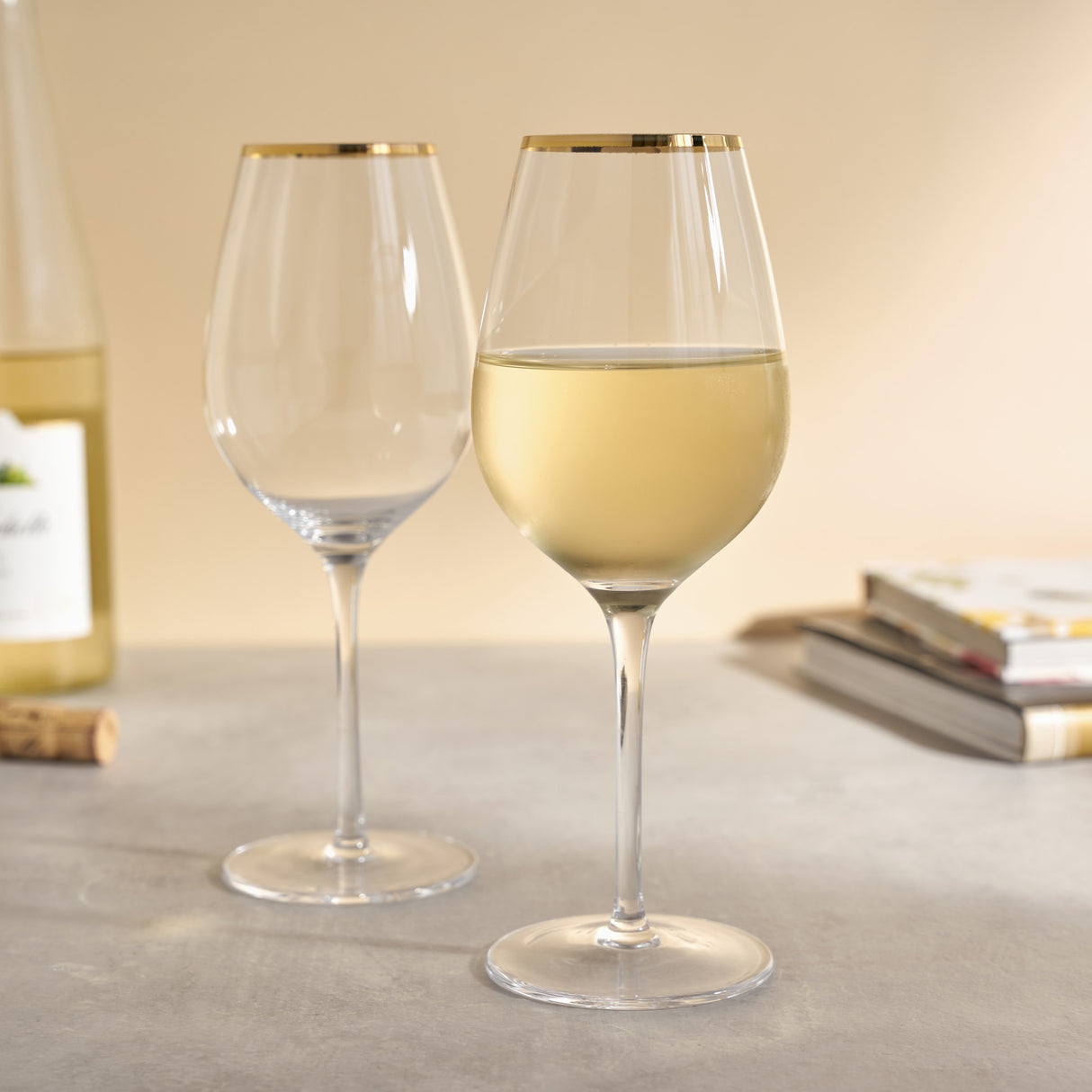 Gilded stemmed wine glass set by twine