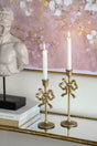 Set-of-2-Gold-Cast-Iron-Candle-Holders-with-Playful-Bow-Design-Candle-Holders