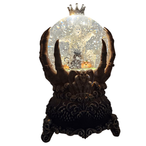 Spooky Spinning Waterglobe held by Skeleton Hands