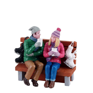 Hot Cocoa Drinkers on a Bench