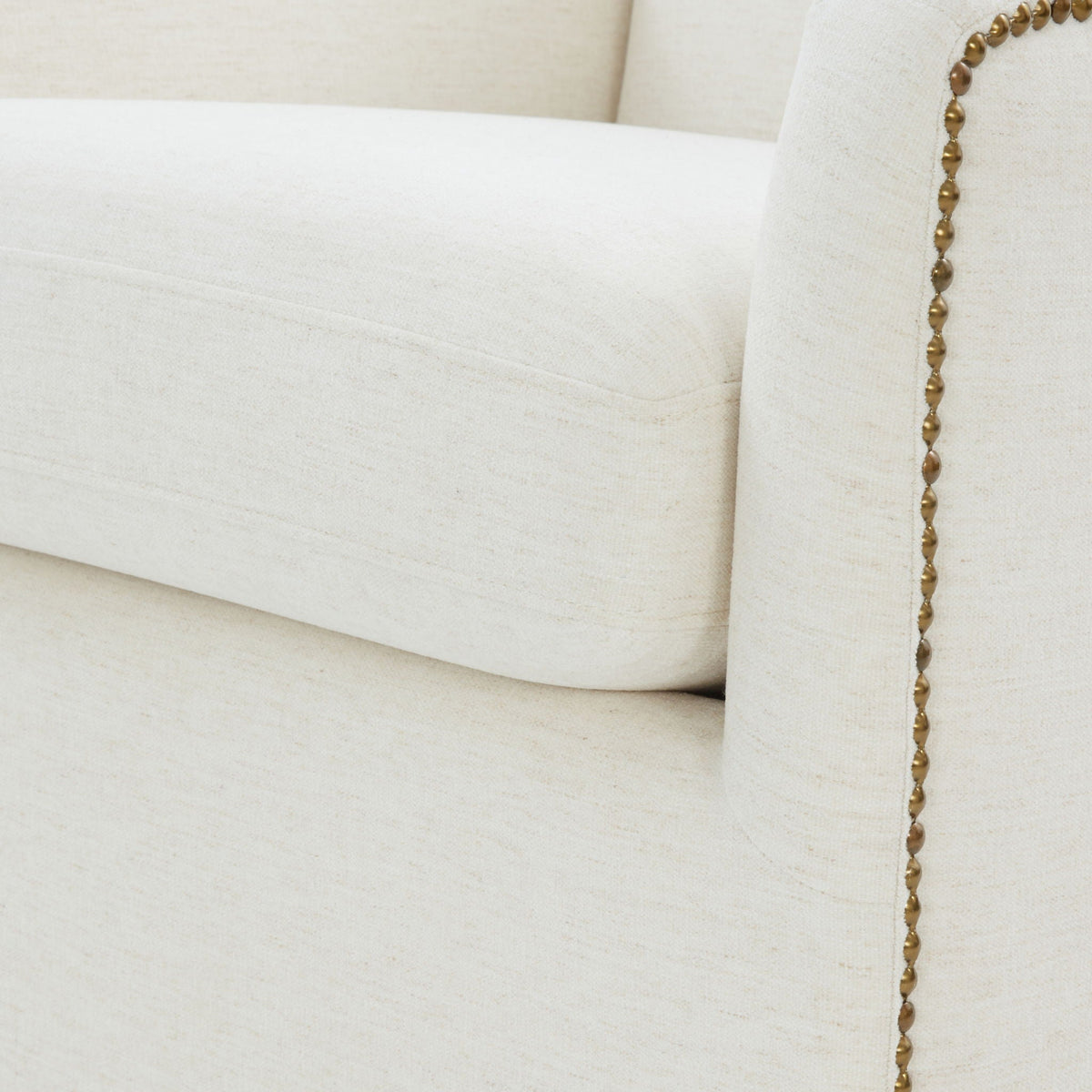 Cream Swivel Accent Chair with Antique Brass Nailhead Trim