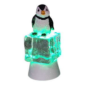 Penguin Sitting on Color-changing Lighted Icecube -