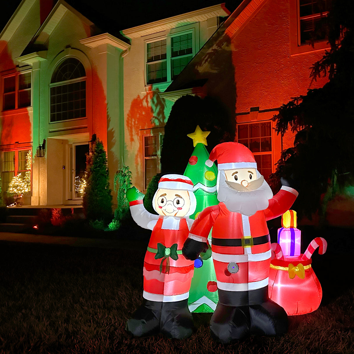 6-Ft. Tall Prelit Mr. and Mrs. Claus with Tree Inflatable with Music