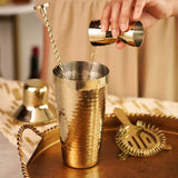 Gold hammered barware set by twine