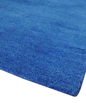 Custom made solid Blue Woolen Hand Tufted contemporary area Rug