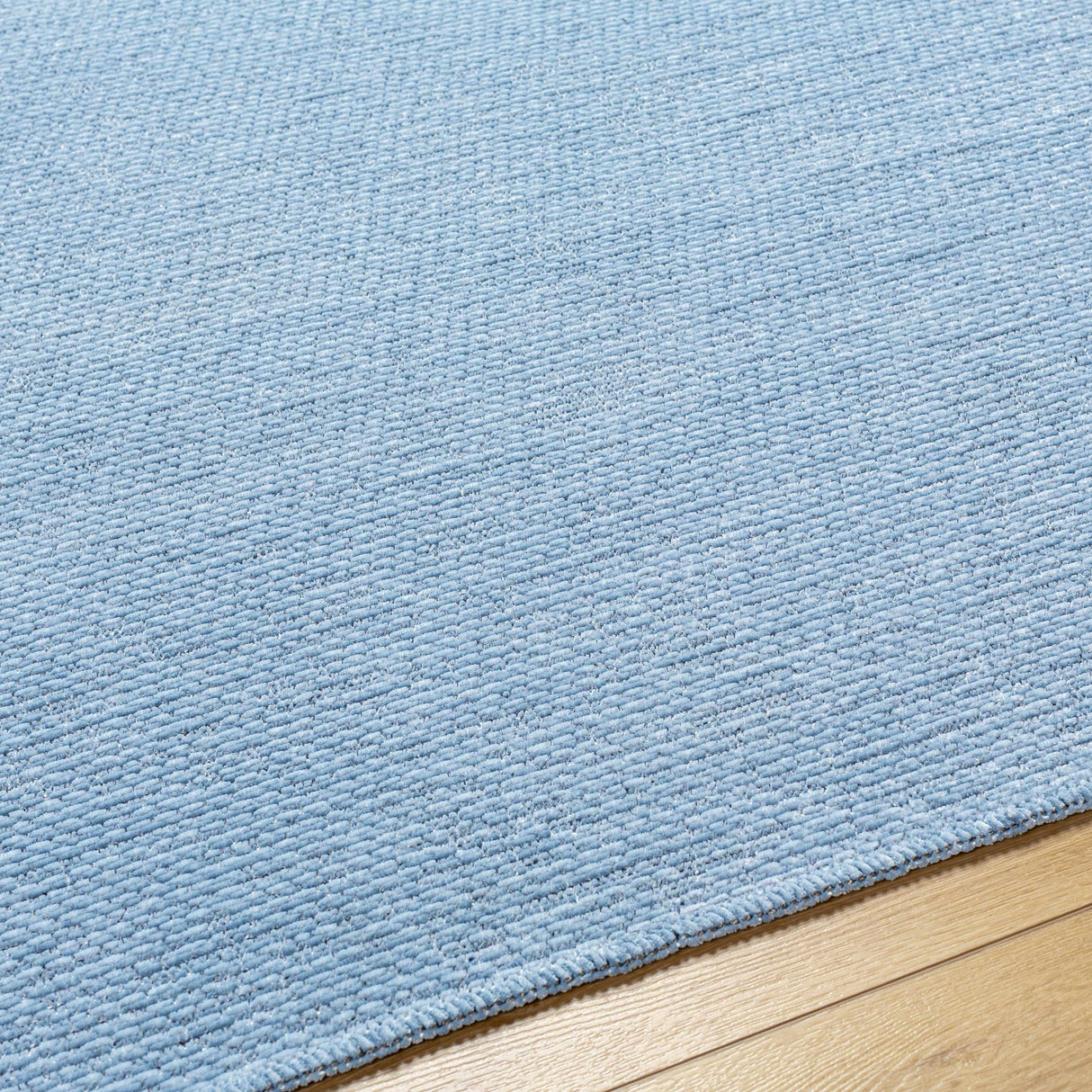 Isako Blue Solid Washable Area Rug - Clearance