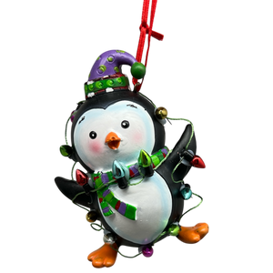Festive Penguin With Holiday Lights and Purple Hat